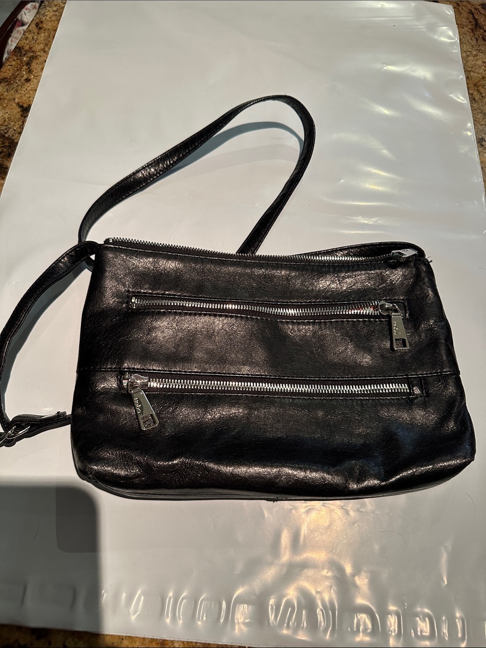 Hobo the Mara. Black leather.